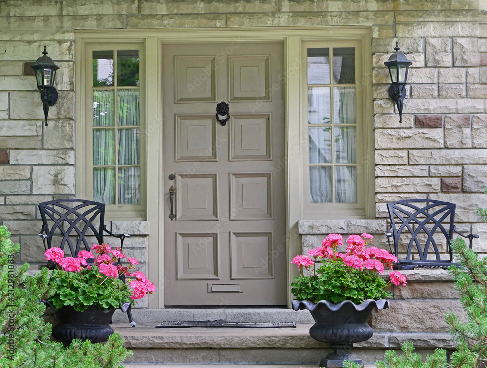 Fototapeta premium front door of house with flower pot.
