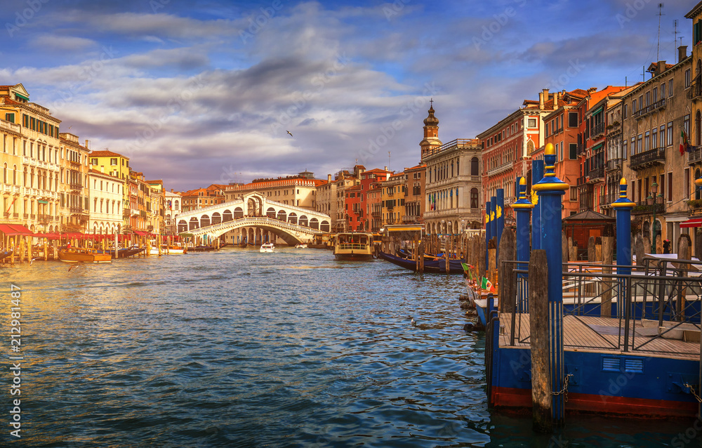 Rialto bridge in Venice, Italy. Venice Grand Canal. Architecture and landmarks of Venice. Venice postcard with Venice gondolas