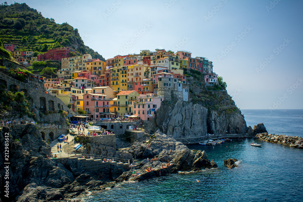 The Town of Manarola builded on the Cliff in a Summer Day