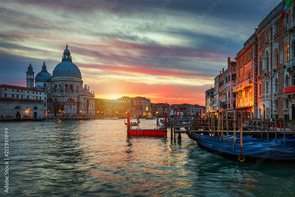 Sunset in Venice. Image of Grand Canal in Venice, with Santa Maria della Salute Basilica in the background. Venice is a popular tourist destination of Europe. Venice, Italy.