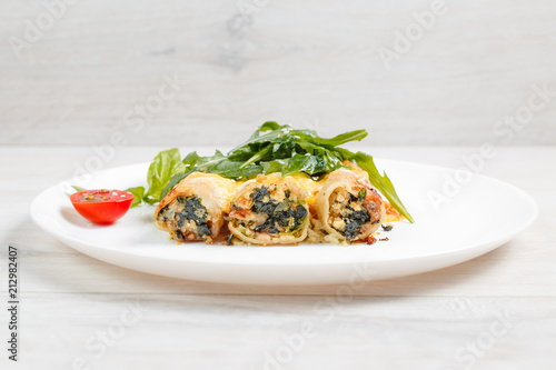Cannelloni with spinach  cheese and bechamel sauce.
