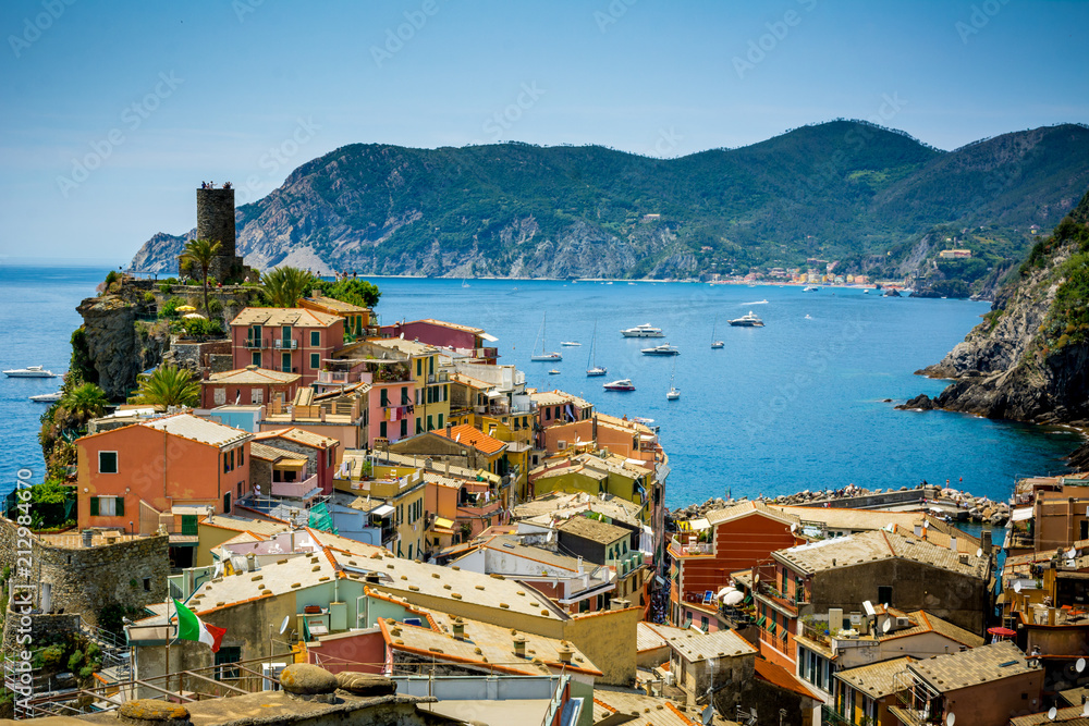 Horizontal View of the Town of Vernazza on blue Sea and the Coastline of the Liguria Background.