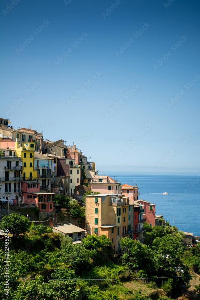 Vertical View of the city of Corniglia  on Blue Sky and Sea Background in the Italian National Park of the Cinque Terre.
