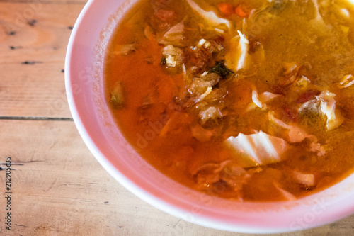 Tongseng goat or beef stew dish in curry soup with vegetables and sweet soy sauce. An exotic traditional food from Javanese Indonesia