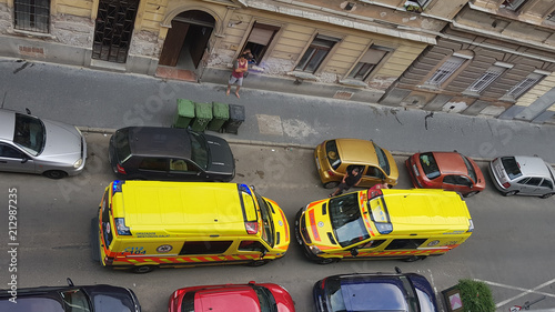 Hungarian yellow ambulances opposed to each other