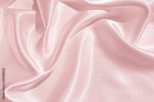 The texture of the satin fabric of pink color for the background  photo