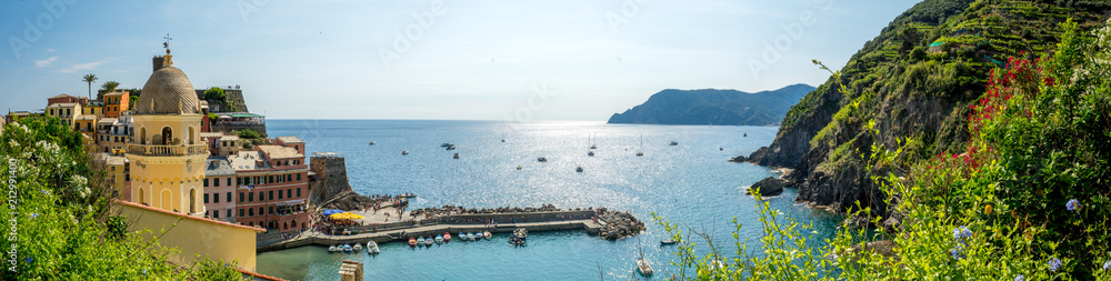 Panoramic View of the Bay in front of the Town of Vernazza on Blue Sky Background. - obrazy, fototapety, plakaty 