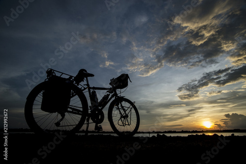 silhouette of a bicycle before sunset background.