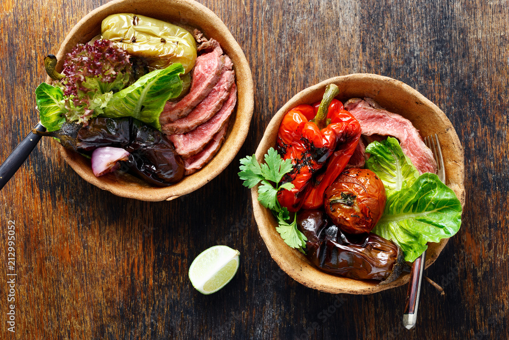 Grilled steak and vegetables served bread plate top view Grilled steak and vegetables served bread plate top view