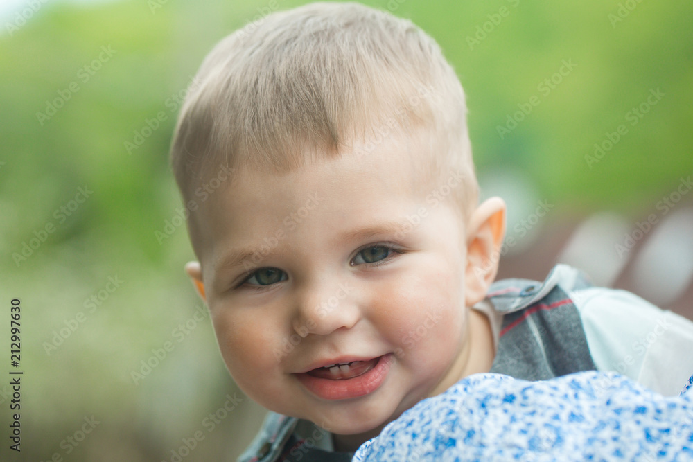 Toddler boy smiling with baby teeth on cute face Toddler boy smiling with baby teeth on cute face