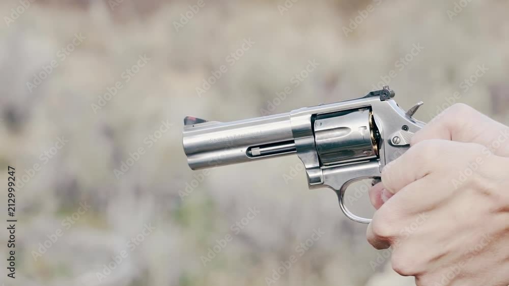 Close up of a pistol firing in 120fps slow motion Close up of a pistol firing in 120fps slow motion