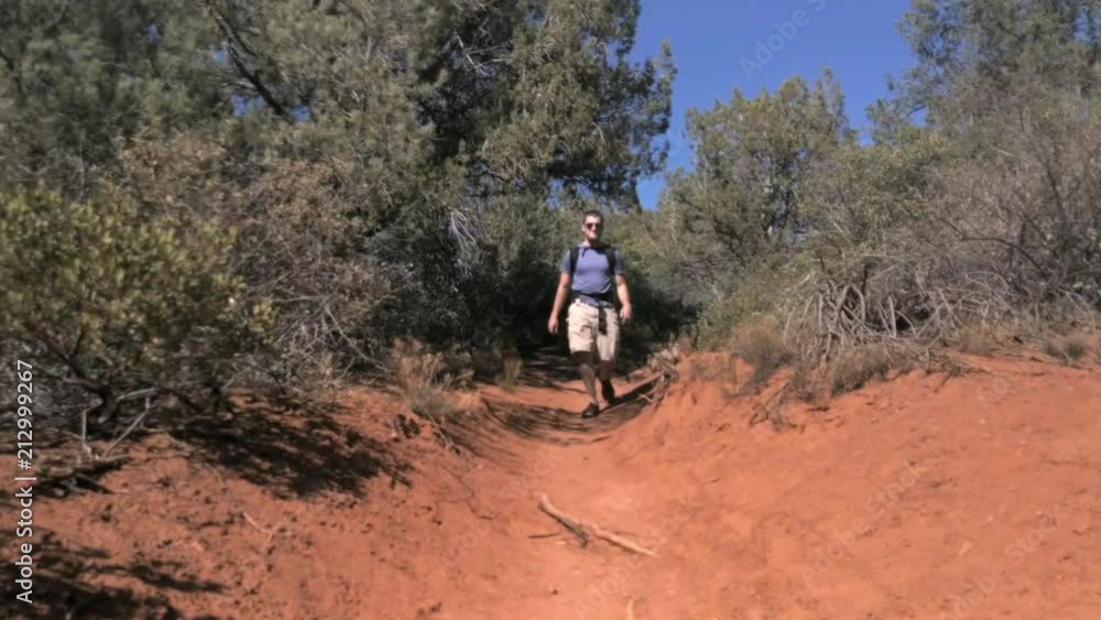 Caucasian Man Carrying Toddler in Baby Carrier While Hiking in Arizona Caucasian Man Carrying Toddler in Baby Carrier While Hiking in Arizona