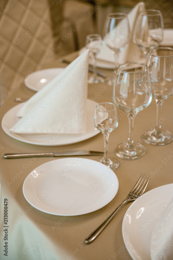 Elegant serving of a festive dinner in the restaurant table Elegant serving of a festive dinner in the restaurant table