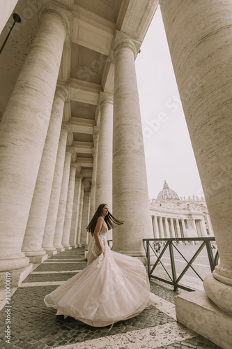 Pretty young bride in wedding dress in the Vatican