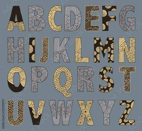 hand drawn alphabet decorated with graphic doodles in silver and gold