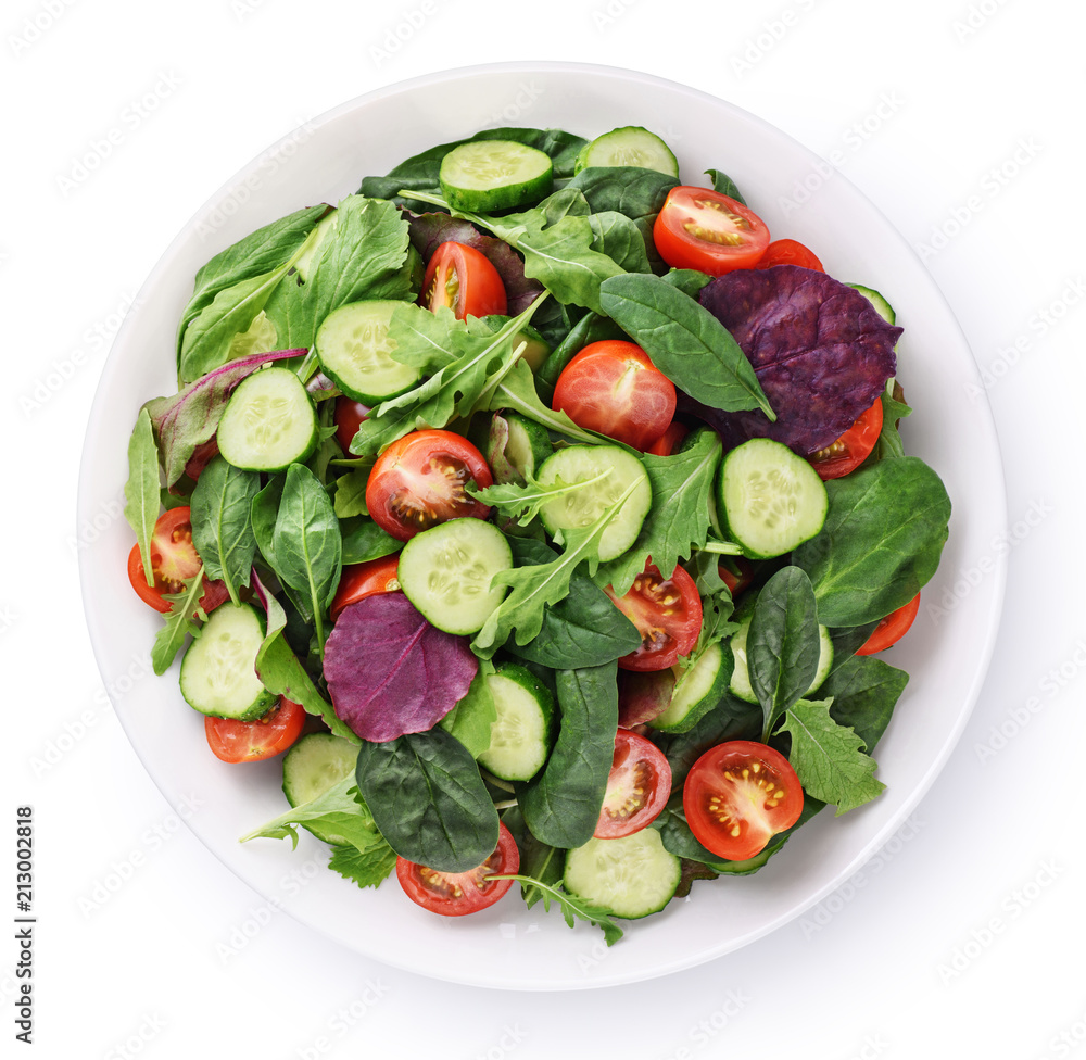 Fresh green salad with tomatoes isolated on white background.