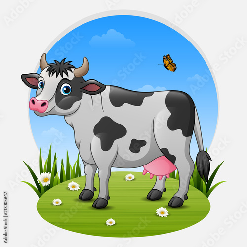 Cartoon cow on green meadow
