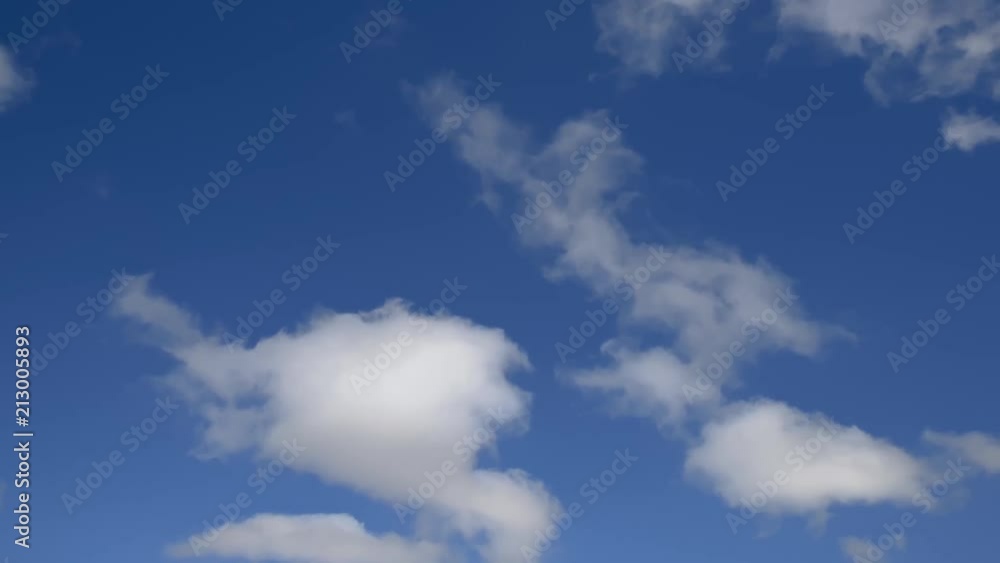 thick cumulus clouds floating the plane flies across the sky thick cumulus clouds floating the plane flies across the sky