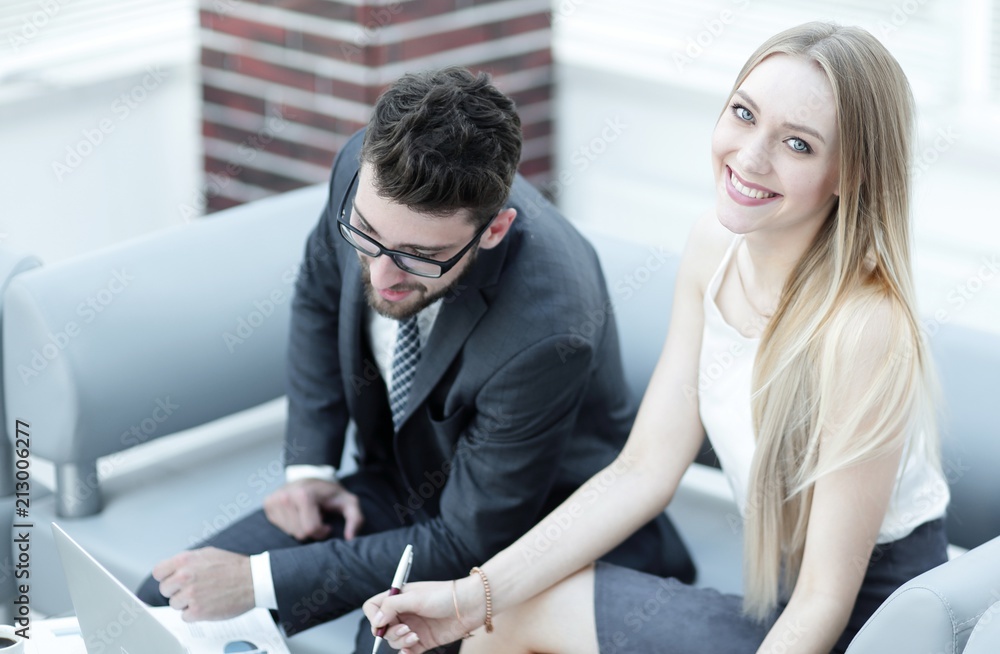 manager and client browsing information on the laptop. manager and client browsing information on the laptop.