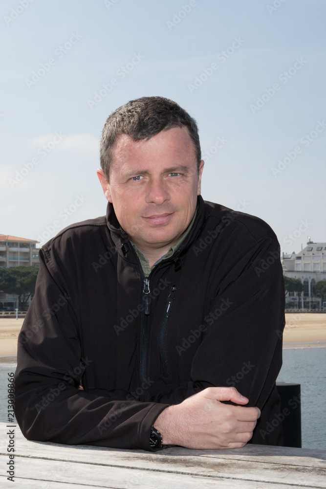 handsome man outdoors alone on the sea side handsome man outdoors alone on the sea side