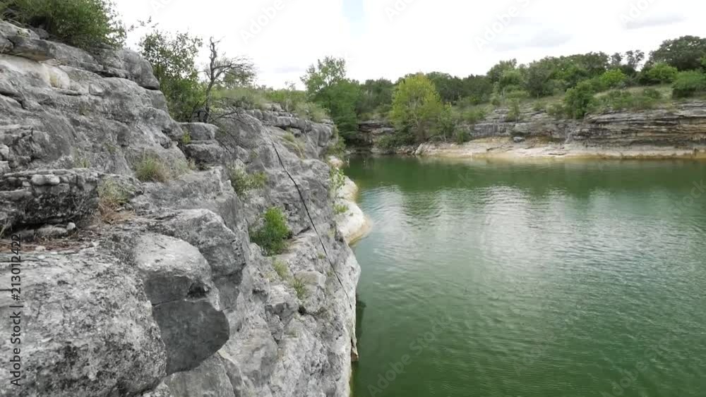 Cliff side going into green water Cliff side going into green water
