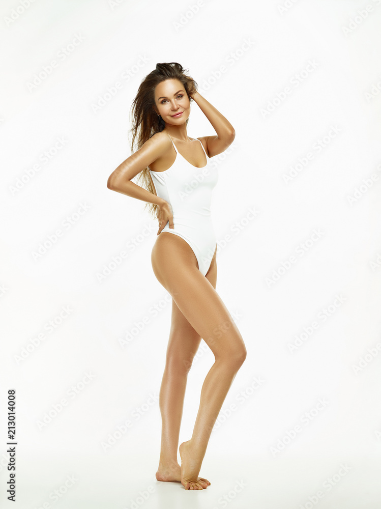 Fototapeta premium Fit, healthy and sporty girl in swimsuit. Sport, fitness, diet and healthcare concept.