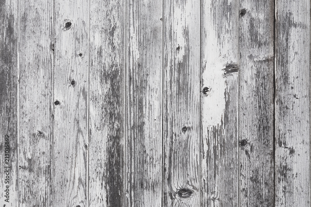 closeup of old grungy vertical planks with peeling white paint closeup of old grungy vertical planks with peeling white paint