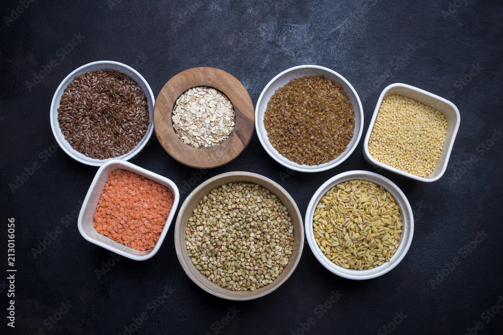 Mixed grains on dark background, overhead view, close up Mixed grains on dark background, overhead view, close up