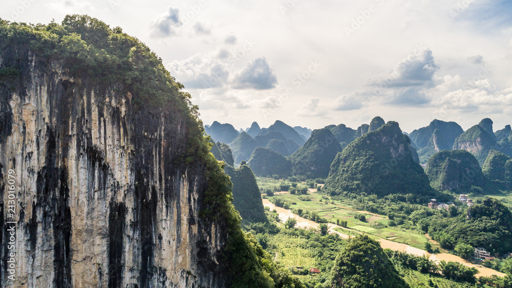 view of cliff and mountains in a sunny afternoon, Guilin, China