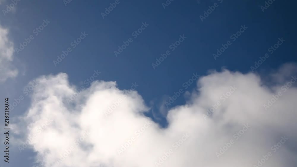 Beautiful white fluffy moving clouds over blue sky. Beautiful white fluffy moving clouds over blue sky.