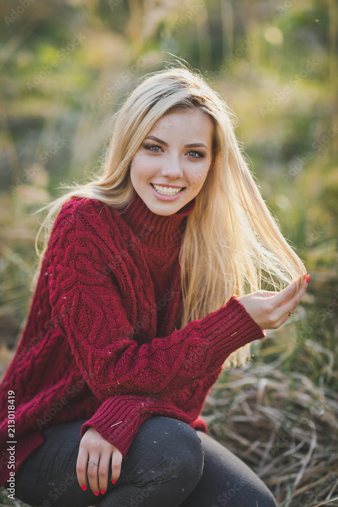 The girl smiles happily among the reeds 1383.