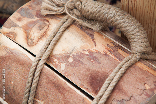 bundle of firewood tied up with a rope photo