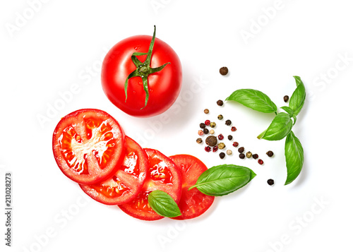 Ripe red tomatoes with basil, rosemary and pepper isolated on white background. Top view.