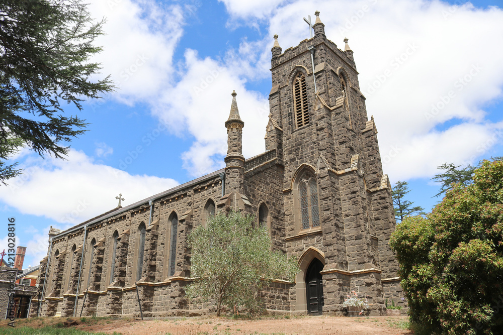 KYNETON, AUSTRALIA - February 11, 2018: St Paul’s Church of England (1856) bluestone building has seven bays and a tower which was added in 1928
