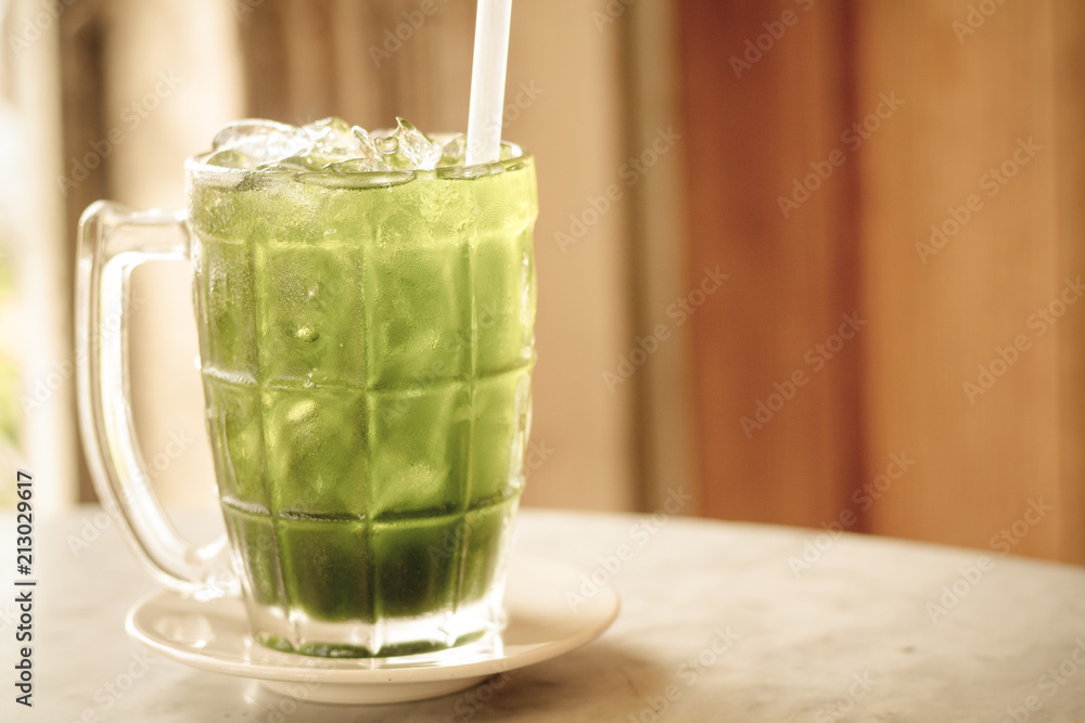 Green Cordial Syrup / Green Cordial Syrup In Clear Glass On Table. Green Cordial Syrup / Green Cordial Syrup In Clear Glass On Table.