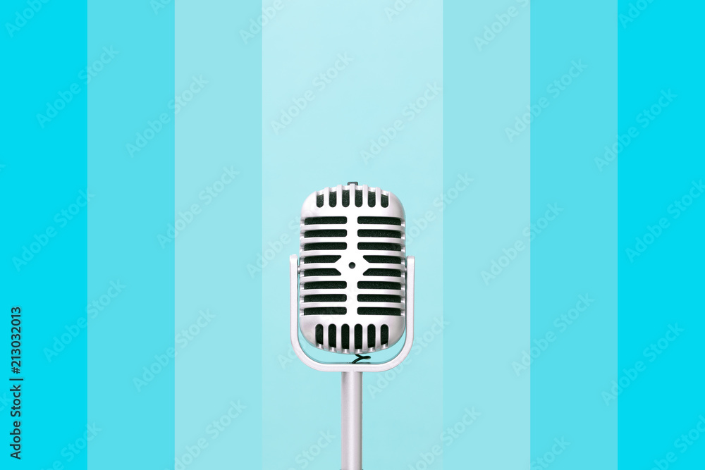 Retro microphone on gradient blue color wall background Retro microphone on gradient blue color wall background