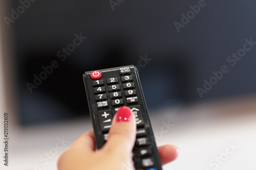 Watching TV and using remote controller