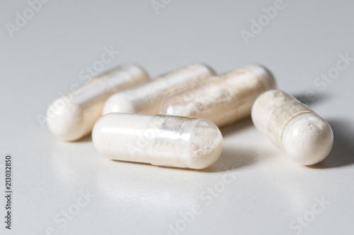 Bunch of  Antibiotics capsules on white background