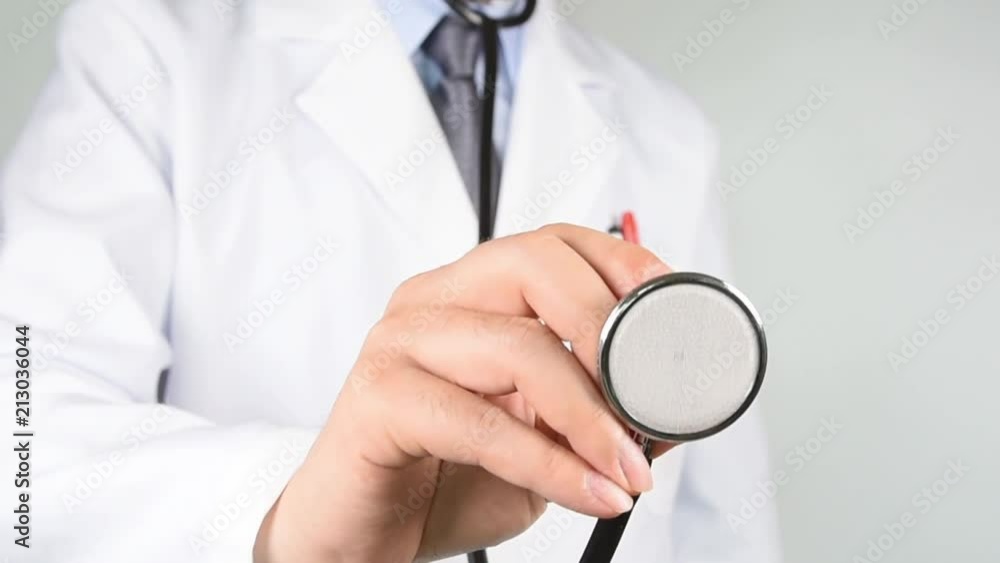 Male doctor hand holding a stethoscope. Male doctor hand holding a stethoscope.
