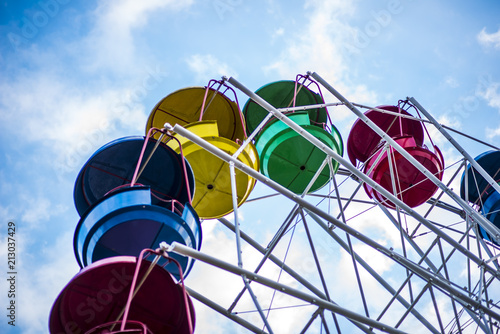Multicolour ferris wheel on blue sky background