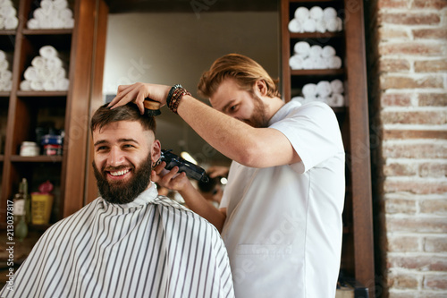 Barber Shop. Man Getting Haircut In Hair Salon