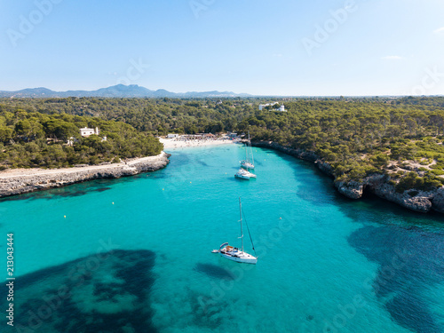 Aerial: The beach of Cala Mondrago in Mallorca, Spain © castenoid