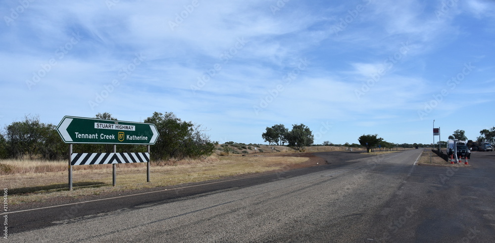 Renner Springs, Australia - Jun 13, 2018. Stuart Highway at Renner Springs. Empty road to Katherine and Tennant Creek. Renner Springs, Australia - Jun 13, 2018. Stuart Highway at Renner Springs. Empty road to Katherine and Tennant Creek.