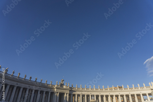 Statues ontop of the colonnades in St Peter's square, Vatican City, Rome, Italy