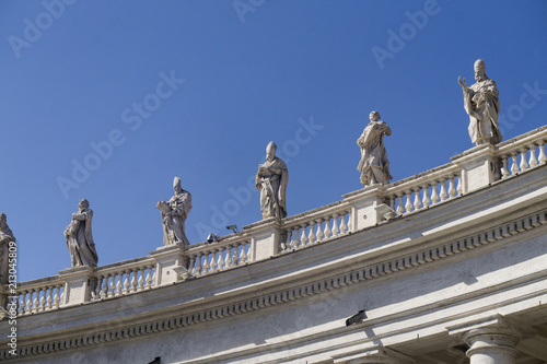 Statues ontop of the colonnades in St Peter's square, Vatican City, Rome, Italy