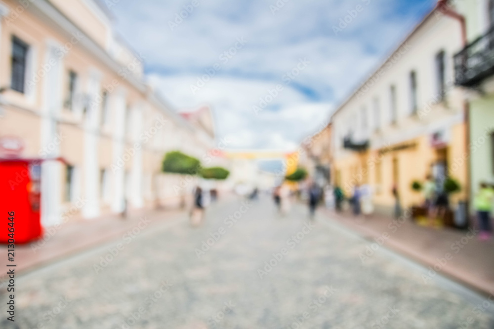  Blurred background of the tourist street of a European city.