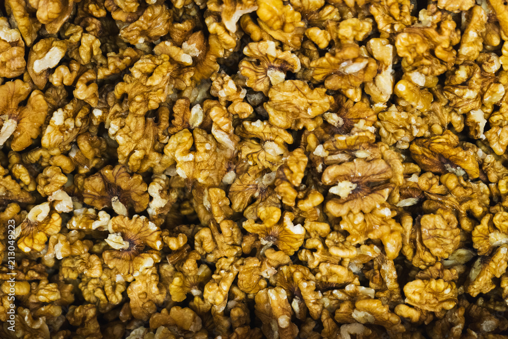 Peeled walnuts without shell, close-up top view on the counter of the vegetable market. Peeled walnuts without shell, close-up top view on the counter of the vegetable market.