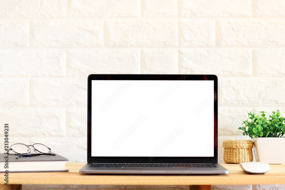 Blank screen Laptop on wooden table at home Office Blank screen Laptop on wooden table at home Office