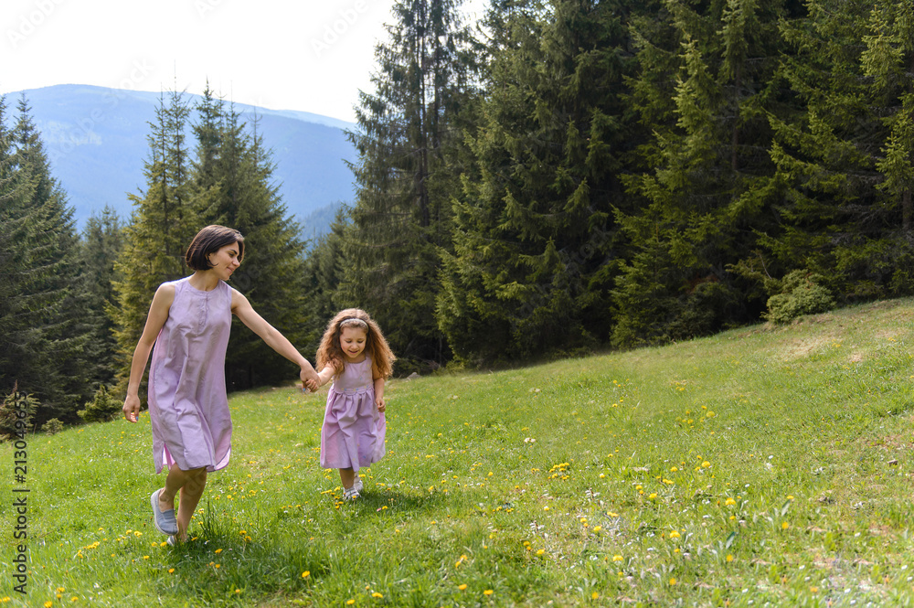 Mother and Daughter Walking at Forest Mother and Daughter Walking at Forest