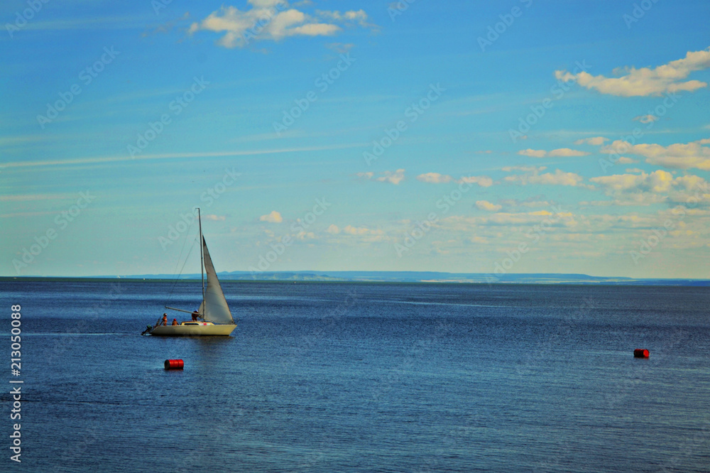 Fototapeta premium Sailing boat floats on water.